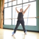 A MOVE Pilates Instructor stretching with bands